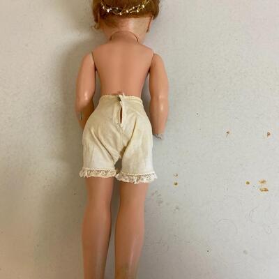 Vintage hard plastic doll, 17 inchs tall with lace knickers.