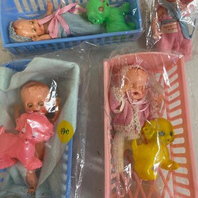 Lot of 3 vintage plastic babies in cradles
