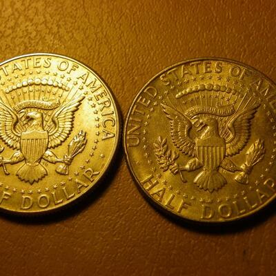 2- 1964 Kennedy Silver half dollars.