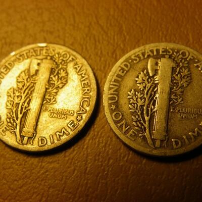 2- 1937 and 1935 Mercury silver dimes.