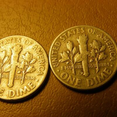 2- 1957 and 1953 Roosevelt silver dimes.