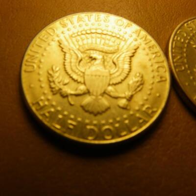 More 1964 Kennedy silver half dollar coins.