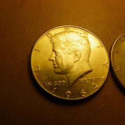 More 1964 Kennedy silver half dollar coins.