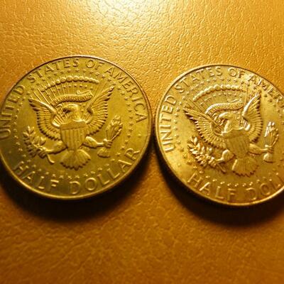 2- 1968 and 1964 Kennedy halve dollar coins.