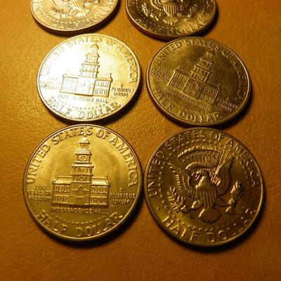 8- Kennedy half dollars with 2 centennial coins.