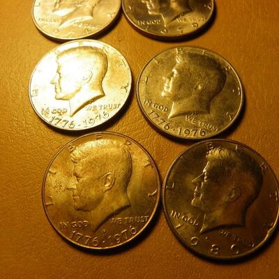 8- Kennedy half dollars with 2 centennial coins.