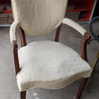 Antique but comfy cream arm chair