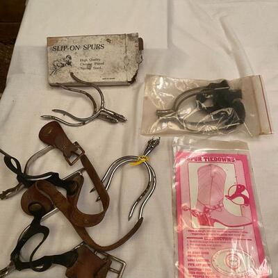 Assortment of spurs and slip on spurs