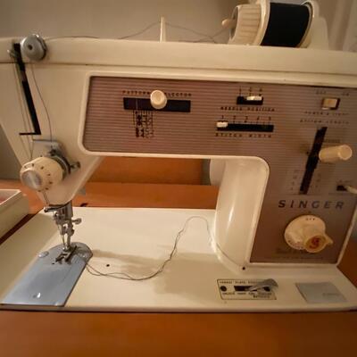 Vintage Singer â€œTouch & Sewâ€ 646 sewing machine in cabinet with chair