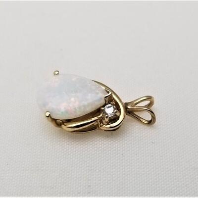 Lot #152  14kt Yellow Gold Pendant with Oval Opal and small diamond