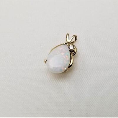 Lot #152  14kt Yellow Gold Pendant with Oval Opal and small diamond