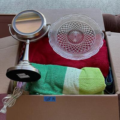 Lot 14- box of misc. towels, glass plate, floor light.