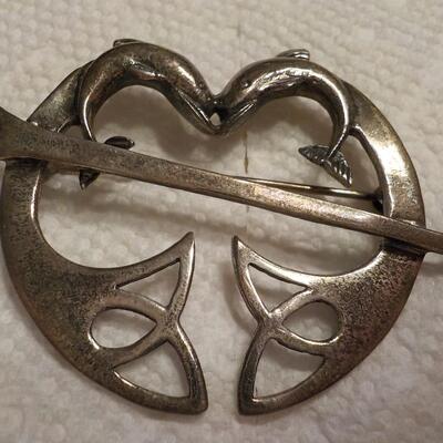 Sterling silver vintage dolphins pin.