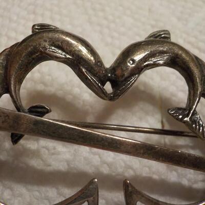 Sterling silver vintage dolphins pin.