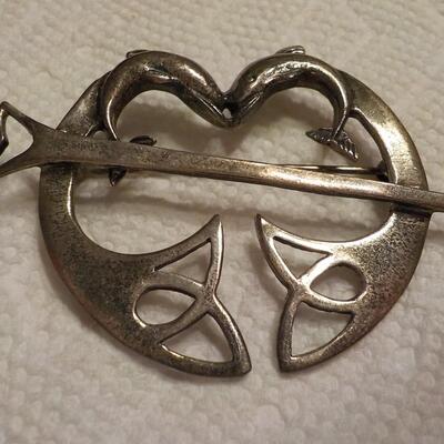 Sterling silver vintage dolphins pin.