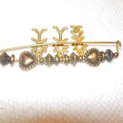 Vintage family brass pin.