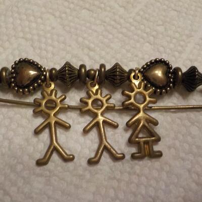 Vintage family brass pin.
