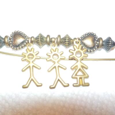 Vintage family brass pin.