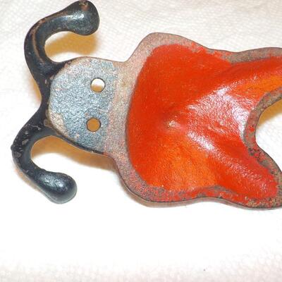Vintage red fox cast iron hanger.