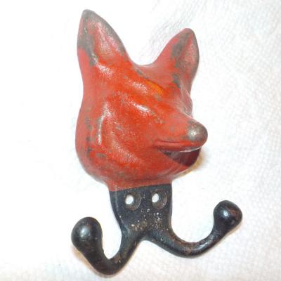 Vintage red fox cast iron hanger.