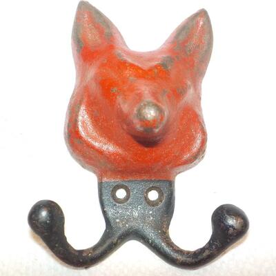 Vintage red fox cast iron hanger.