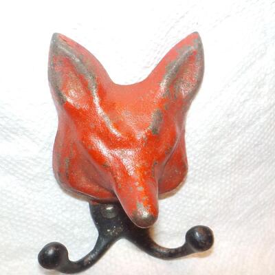 Vintage red fox cast iron hanger.