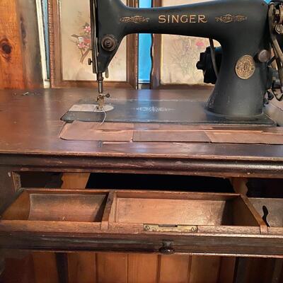 Vintage singer sewing machine in cabinet