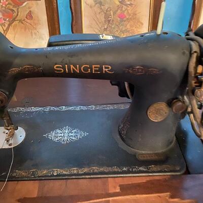 Vintage singer sewing machine in cabinet
