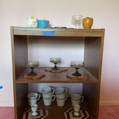 lot 38- mid century modern rolling cart, glasses, plate stands, signed wooden apple, misc. glassware, set of (6) pyrex mugs