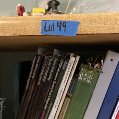 lot 49- shelf of misc. cooking/baking books, tupper ware, racks, stepstool