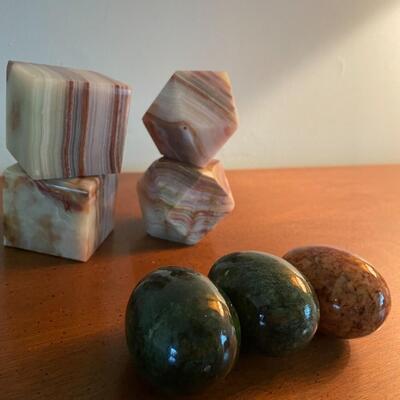 lot 64- (4) pieces of granite marble decor, (3) granite eggs