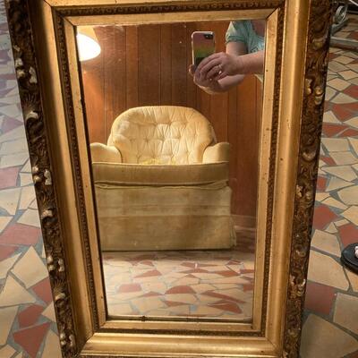 Antique mirror with ornate frame