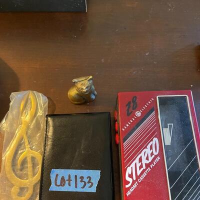 lot 133- Cassette player, wallet, brass cat, brass musical note, coin/medallion