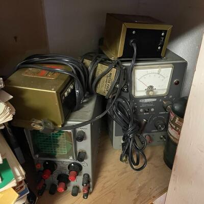 lot 165- Heath kit regulation power supply, sliders, misc. books, misc. machines