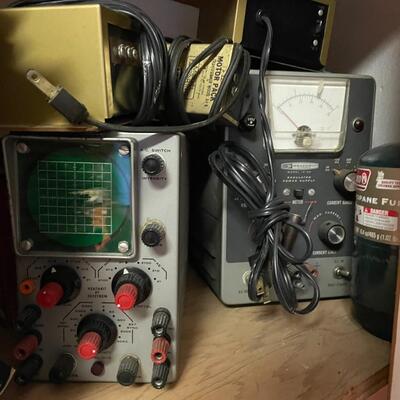 lot 165- Heath kit regulation power supply, sliders, misc. books, misc. machines