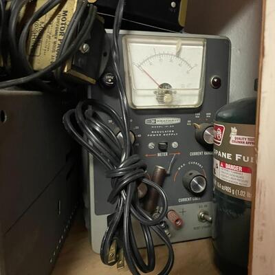 lot 165- Heath kit regulation power supply, sliders, misc. books, misc. machines