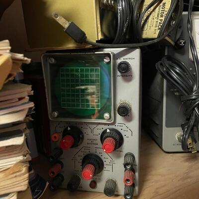 lot 165- Heath kit regulation power supply, sliders, misc. books, misc. machines