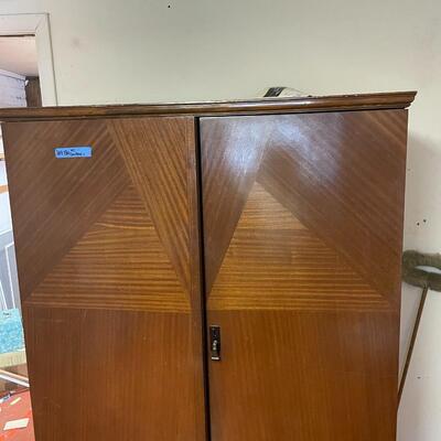 lot 180- mid century modern wood wardrobe cabinet with contents (41 in. wide, 68 in. tall, 19 in. long)