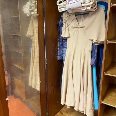 lot 180- mid century modern wood wardrobe cabinet with contents (41 in. wide, 68 in. tall, 19 in. long)