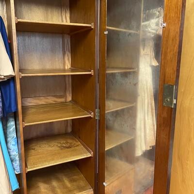lot 180- mid century modern wood wardrobe cabinet with contents (41 in. wide, 68 in. tall, 19 in. long)