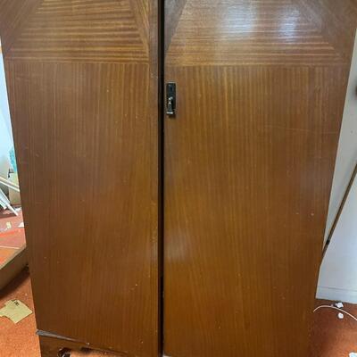 lot 180- mid century modern wood wardrobe cabinet with contents (41 in. wide, 68 in. tall, 19 in. long)