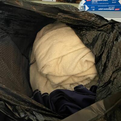 lot 190- (2) large bags with misc. clothes and blankets