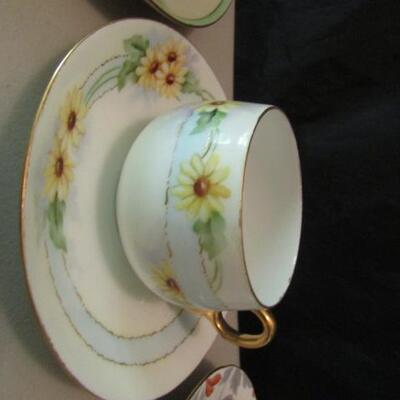 Group of Seven Fine Bone China Cups and Saucers- Assorted Makers (One is a Mustache Cup)