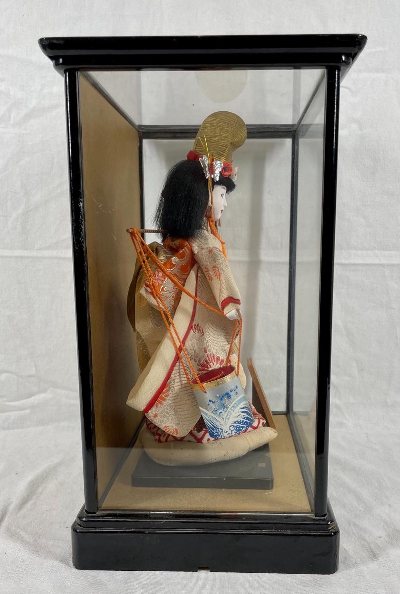 Chinese doll in glass case hotsell