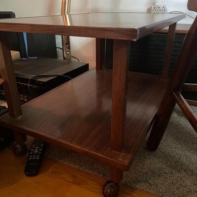 lot 207- Mid century modern rolling table and small stool
