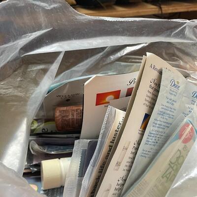 lot 230- box of misc. keys, keychains, dog door stopper, locks, bag of misc. toiletries 