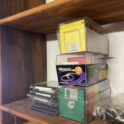 lot 249- shelves of items, books, cassettes, tools, lamps, videos circa 1950's, dell speakers, box, etc.