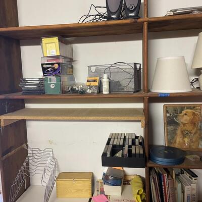 lot 249- shelves of items, books, cassettes, tools, lamps, videos circa 1950's, dell speakers, box, etc.