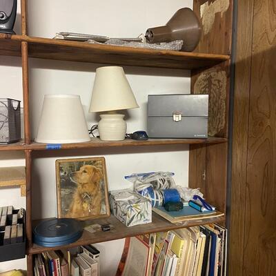 lot 249- shelves of items, books, cassettes, tools, lamps, videos circa 1950's, dell speakers, box, etc.
