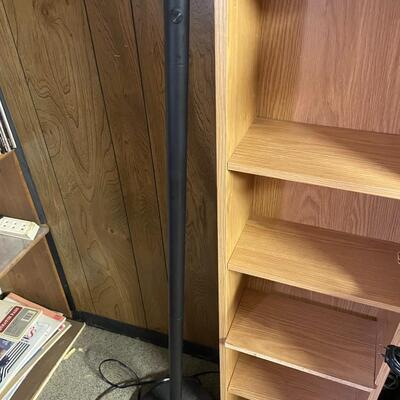 lot 256- Misc. lamps, black book case with contents, tall brown case
